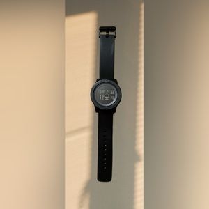 Skmei watch that tells time,date,day,lights up,stop watch,and water resistant.
